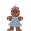 Décoration, fille en pain d'épices, avec une robe à motif de flocon de neige.