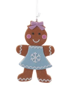 Décoration, fille en pain d'épices, avec une robe à motif de flocon de neige.