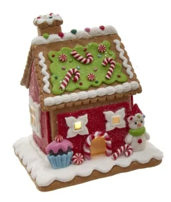 Maison en pain d'épices avec bonhomme de neige.