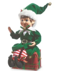 Pièce de table, elfe en vert, assis sur un cadeau de Noël