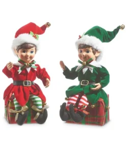 Pièce de table, elfe en vert, assis sur un cadeau de Noël