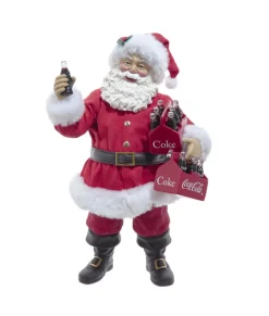 Pièce de table représentant le Père Noël Coca-Cola® tenant deux packs de six