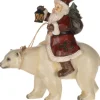 Père Noël chevauchant un ours polaire