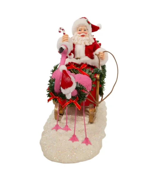 Père Noël Fabriché™ en traîneau avec flamants roses 10"